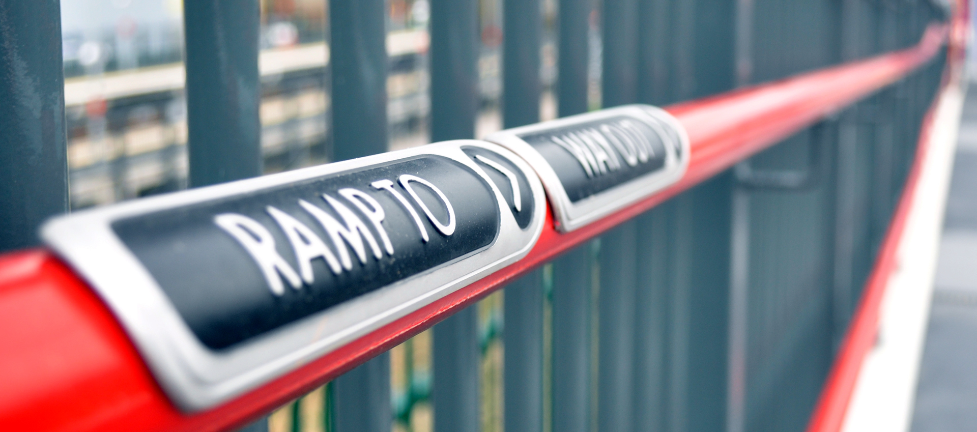 Photo: handrail and sign at Low Moor Station